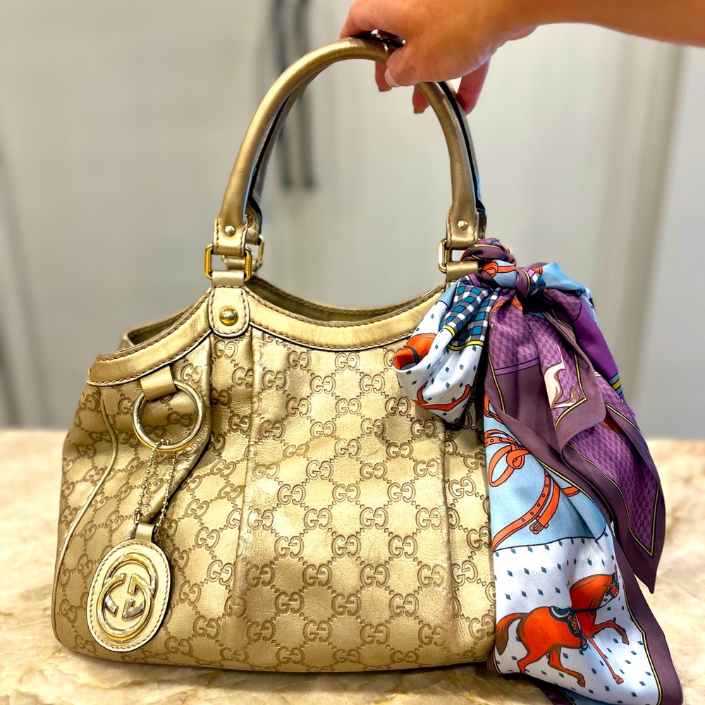 Gucci Sukey in  gold guccissima leather.
